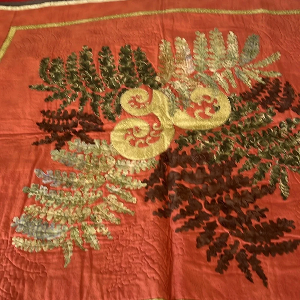 Beautiful terra cotta and green quilt wall hanging. Homemade.